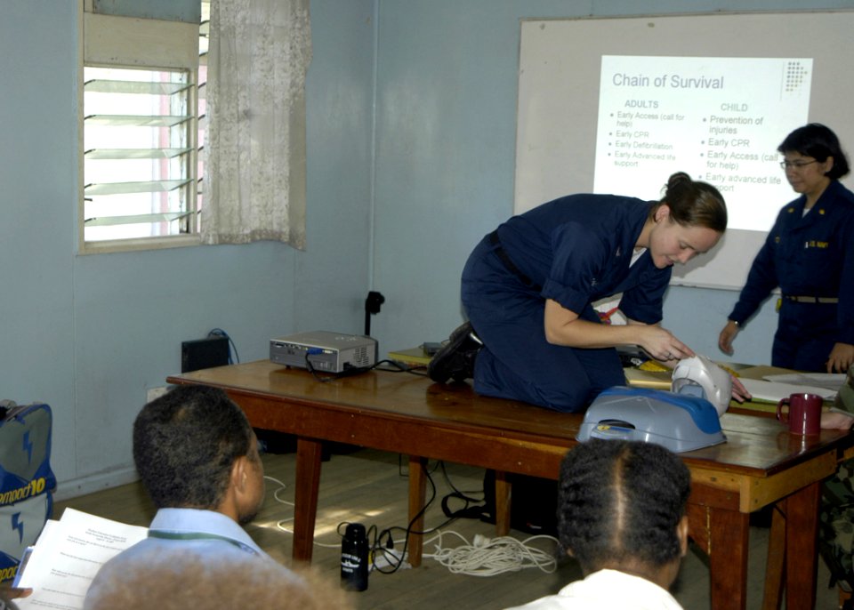 US Navy 070809-N-6410J-033 Aviation Ordnanceman 3rd Class Ashley Cameron demonstrates cardio pulmonary resuscitation (CPR) for a group of nurses at Modilon General Hospital