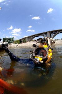 US Navy 070811-N-3093M-007 Navy Diver 1st Class Joshua Harsh attached to Mobile Diving and Salvage Unit (MDSU) 2 from Naval Amphibious Base Little Creek, Va., prepares to leave the surface on a salvage dive in the Mississippi R