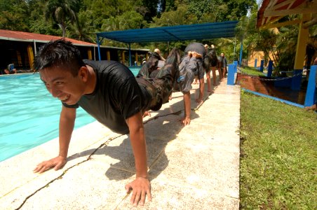 US Navy 070810-N-0989H-432 U.S. Marines assigned to a mobile training team observe Guatemalan sailors and marines conduct a series of aqua aerobics and exercises during Small Unit Tactics training photo