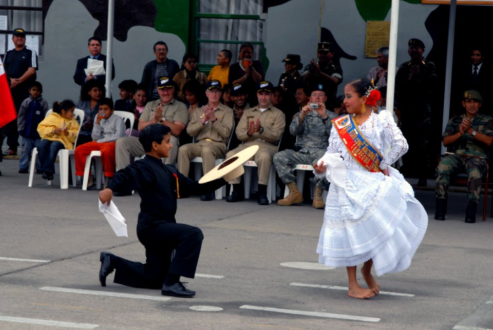 US Navy 070812-N-8704K-272 Alvako Coello and Lupita Carrion perform a dance during a closing ceremony for the Military Sealift Command (MSC) hospital ship USNS Comfort (T-AH 20)