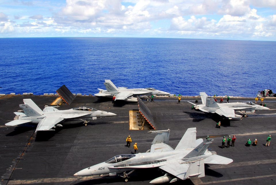 US Navy 070809-N-9760Z-012 A group of F-A-18 Hornets and Super Hornets attached to Carrier Air Wing (CVW) 11 prepare to launch off the flight deck of the nuclear-powered aircraft carrier USS Nimitz (CVN 68)