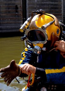 US Navy 070811-N-3093M-020 Chief Navy Diver Scott Maynard attached to Mobile Diving and Salvage Unit (MDSU) 2, readies for a dive into the Mississippi river in support of ongoing search and recovery operations