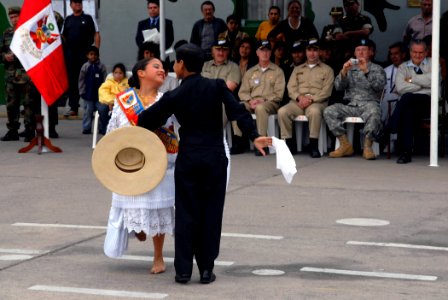 US Navy 070812-N-8704K-269 Lupita Carrion and Alvako Coello perform a dance during a closing ceremony for the Military Sealift Command (MSC) hospital ship USNS Comfort (T-AH 20)