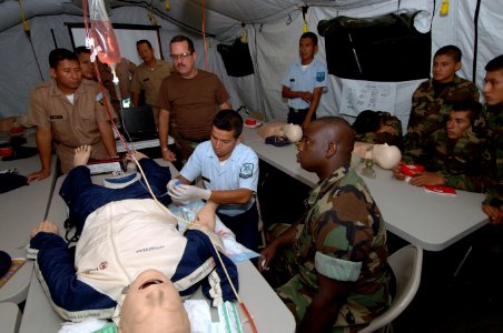 US Navy 070815-N-0989H-027 Sailors attached to Task Group 40.9 provide training to Guatemalan naval officers, sailors and Marines on the proper procedures for inserting an IV into a CPR dummy photo