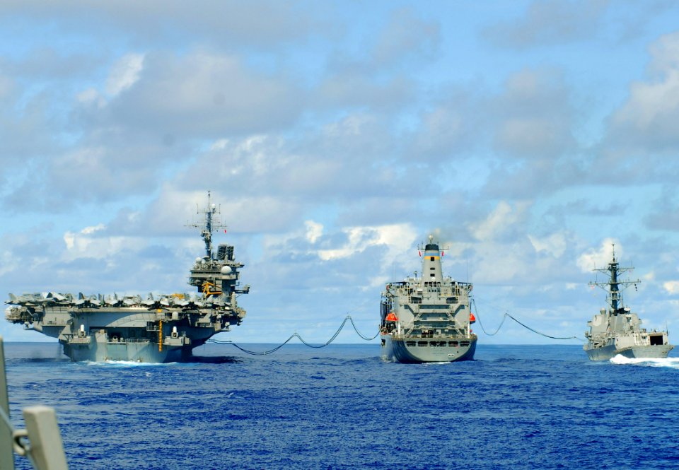 US Navy 070810-N-2638R-001 Fuel lines connect USS Kitty Hawk (CV 63), USS McCampbell (DDG 85) and the oiler USNS John Ericsson (T-AO 194) during a replenishment at sea (RAS)