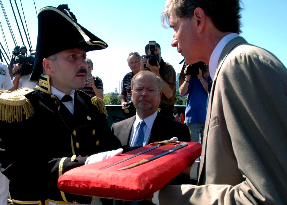US Navy 070814-N-2893B-001 Hull Fulweiler, a descendent of Capt. Isaac Hull, USS Constitution's first fighting commanding officer, presents Cmdr. William A. Bullard III, commanding officer of USS Constitution, with the sw