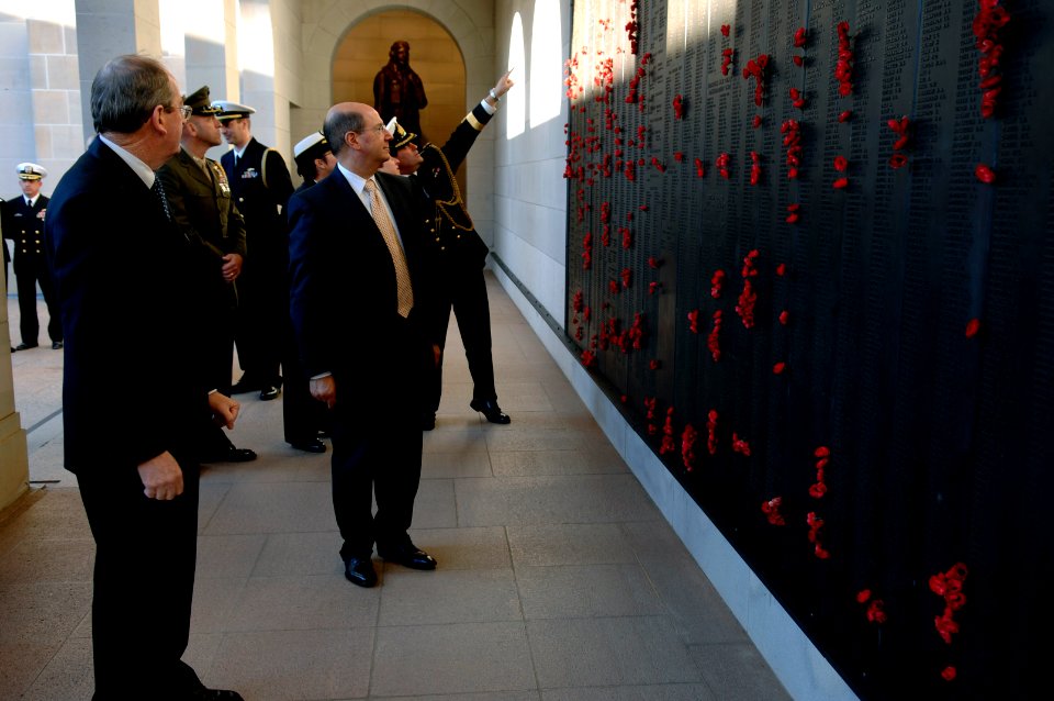 US Navy 070814-N-3642E-175 Secretary of the Navy (SECNAV) The Honorable Dr. Donald C. Winter looks at a dark, bronze panel called the Roll of Honour, a record of over 102,000 Australian servicemen and women who have died in war