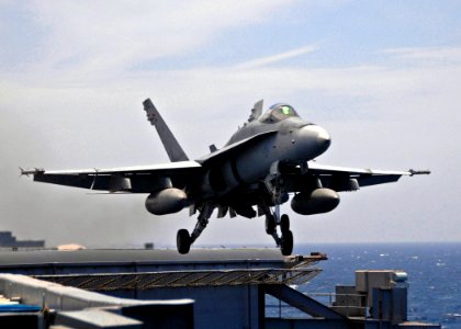 US Navy 070814-N-1229B-117 An F-A-18C Hornet attached to the Blue Blasters of Strike Fighter Squadron (VFA) 34 is launched off the flight deck of the Nimitz-class aircraft carrier USS Abraham Lincoln (CVN 72)