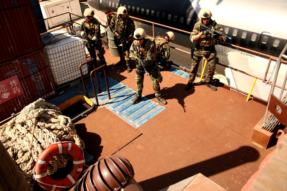 US Navy 070816-N-1328S-004 Sailors from Mobile Security Squadron 3 storm the deck of a transport ship while conducting visit, board, search and seizure training during Seahawk 2007