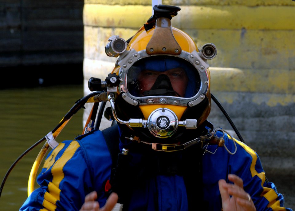 US Navy 070811-N-3093M-017 Chief Navy Diver Scott Maynard attached to Mobile Diving and Salvage Unit (MDSU) 2, readies for a dive into the Mississippi river in support of ongoing search and recovery operations in Minneapolis