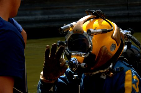 US Navy 070811-N-3093M-021 Chief Navy Diver Scott Maynard attached to Mobile Diving and Salvage Unit (MDSU) 2, readies for a dive into the Mississippi river in support of ongoing search and recovery operations
