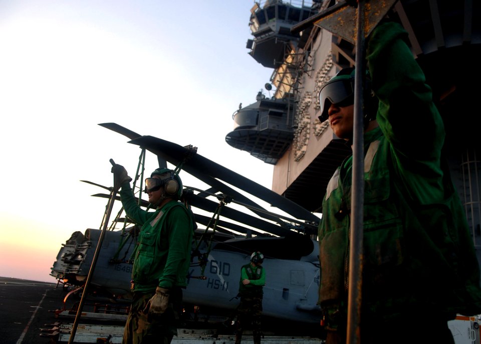 US Navy 070812-N-5928K-005 An Aviation Boatswain's Mates (Equipment) stand by during aircraft recoveries on the flight deck of the nuclear-powered aircraft carrier USS Enterprise (CVN 65)
