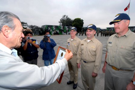 US Navy 070812-N-8704K-192 Peru's Regional President of La Libertad, Jose Murgia, presents a letter of appreciation to the Military Sealift Command (MSC) hospital ship USNS Comfort (T-AH 20), leadership photo