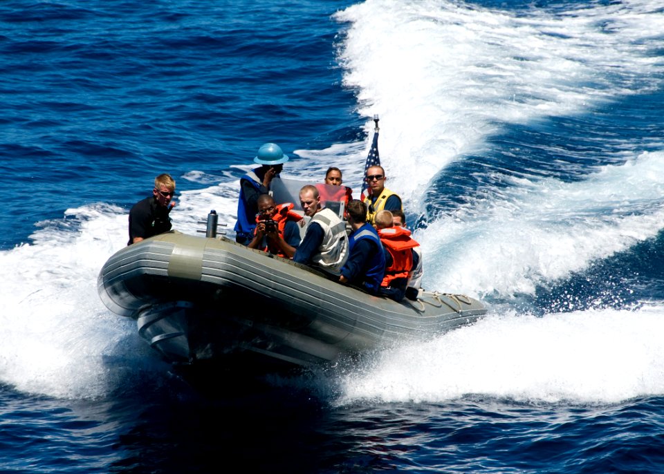 US Navy 070817-N-0483B-001 Sailors aboard amphibious command ship USS Blue Ridge (LCC 19) conduct small boat training with a ridged hull inflatable boat while underway in the western Pacific