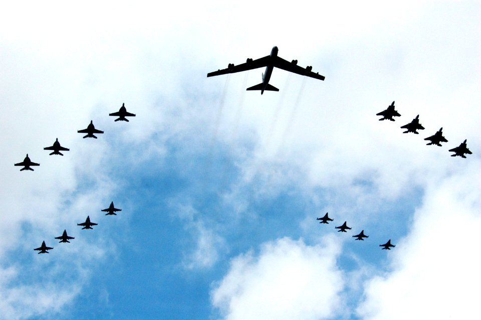 US Navy 070814-N-3136P-067 A United States Air Force B-52 Stratofortress and 16 other aircraft from the Air Force and Navy fly over USS Kitty Hawk (CV 63) during Valiant Shield's photo exercise