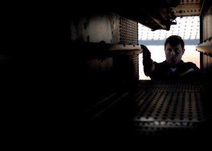 US Navy 070813-N-7981E-324 Fire Controlman Seaman Daniel Logan performs a post-fire inspection of NATO Sea Sparrow launcher aboard Nimitz-class aircraft carrier USS Abraham Lincoln (CVN 72) following a stream raid shoot exercis