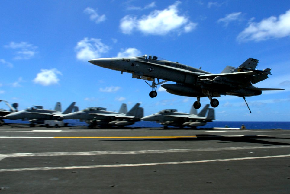 US Navy 070819-N-2659P-267 An F-A-18C Hornet, from the Blue Diamonds of Strike Fighter Squadron (VFA) 146, lands on the flight deck of Nimitz-class aircraft carrier USS John C. Stennis (CVN 74)