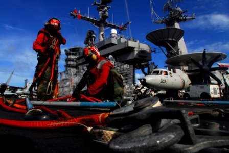US Navy 070818-N-2659P-146 Aviation Ordnancemen Airman Joshua Farmer (left) and Mark Rushing stage cargo pendants and nets on the flight deck of the USS John C. Stennis (CVN 74)