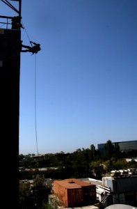 US Navy 070816-N-1328S-006 A Sailor attached to Mobile Security Squadron 3 rappels from the side of a cargo ship while conducting visit, board, search and seizure training during Seahawk 2007