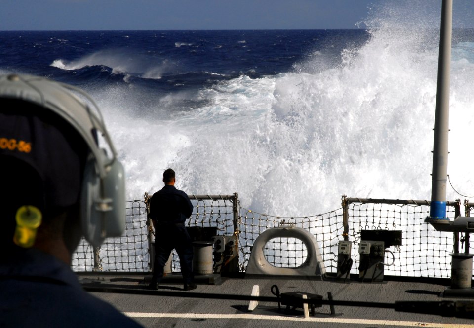 US Navy 070815-N-2638R-003 A Sailor watches water burst up from the propellers of Arleigh Burke-class guided-missile destroyer USS John S. McCain (DDG 56) during a full-power run