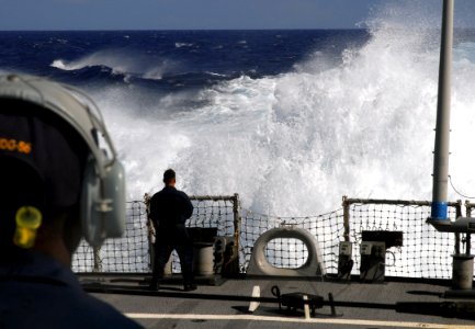 US Navy 070815-N-2638R-003 A Sailor watches water burst up from the propellers of Arleigh Burke-class guided-missile destroyer USS John S. McCain (DDG 56) during a full-power run
