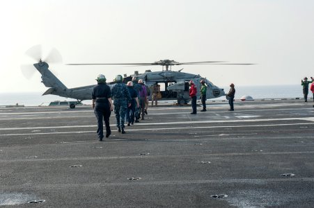USS Carl Vinson, USS George H.W. Bush conduct a cross-deck 141018-N-HD510-032