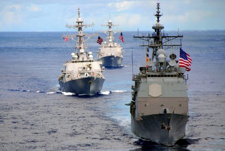 US Navy 070814-N-9760Z-081 USS Princeton (CG 59), USS John Paul Jones (DDG 53) and USS Pinckney (DDG 91) transit behind the nuclear-powered aircraft carrier USS Nimitz (CVN 68) during a joint photo exercise