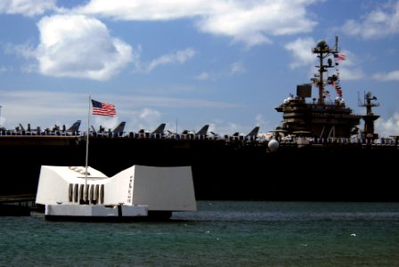 US Navy 070820-N-8157C-093 Nimitz-class aircraft carrier USS John C. Stennis (CVN 74) passes the USS Arizona Memorial as she prepares to pick up family and friends for a Tiger Cruise