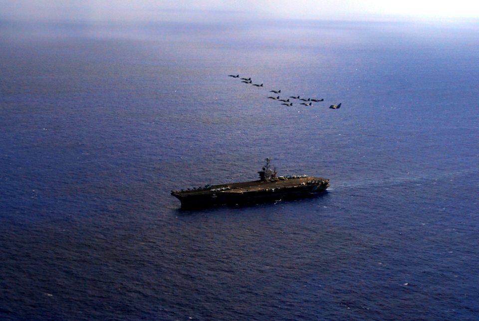 US Navy 070817-N-2659P-330 Aircraft from Carrier Air Wing (CVW) 9 fly over Nimitz-class aircraft carrier USS John C. Stennis (CVN 74) during a practice flight demonstration for an upcoming Tiger Cruise