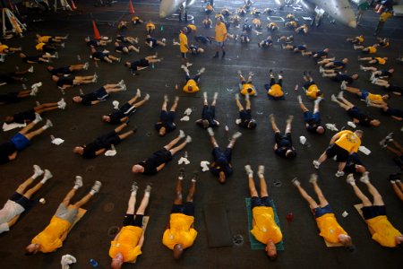 US Navy 070815-N-1598C-056 The chief petty officer's mess, along with chief petty officer selectees, conduct physical training in the hangar bay of nuclear-powered aircraft carrier USS Enterprise (CVN 65) photo