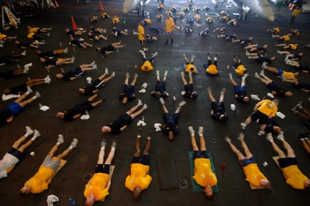 US Navy 070815-N-1598C-056 The chief petty officer's mess, along with chief petty officer selectees, conduct physical training in the hangar bay of nuclear-powered aircraft carrier USS Enterprise (CVN 65)