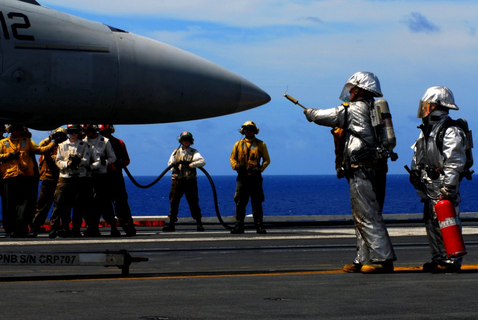 US Navy 070816-N-2659P-145 Flight deck personnel from the crash and salvage team simulate fighting a fire on an F-A-18F Super Hornet, from the