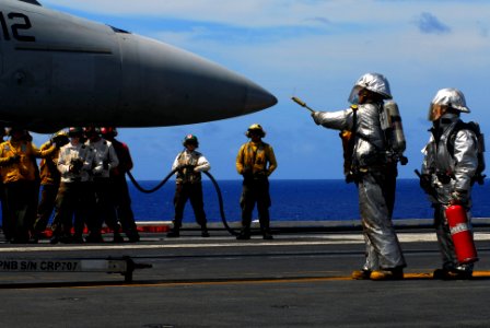 US Navy 070816-N-2659P-145 Flight deck personnel from the crash and salvage team simulate fighting a fire on an F-A-18F Super Hornet, from the
