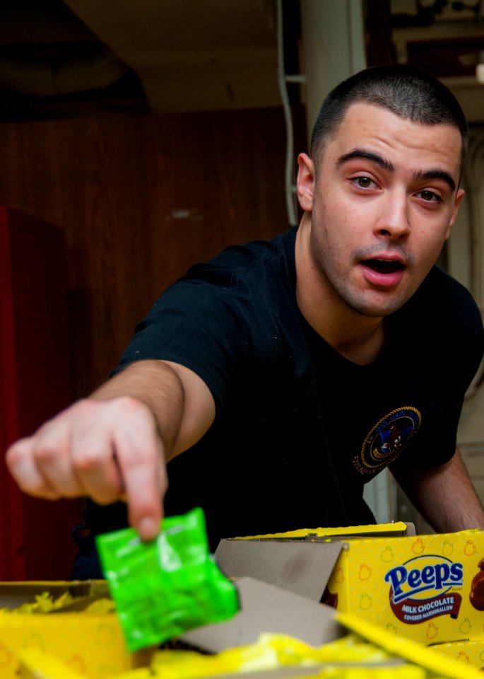 USS Carl Vinson Sailors receive candy 141030-N-WD464-046
