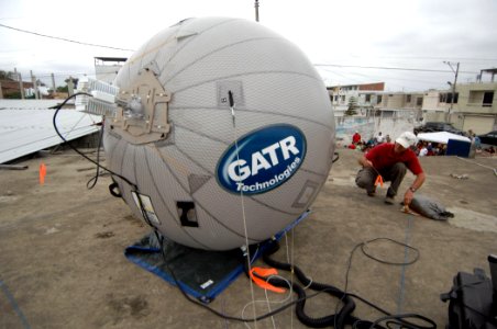 US Navy 070817-N-0194K-041 David Hoffman, a contractor attached to Military Sealift Command hospital ship USNS Comfort (T-AH 20), adjusts a tension cable for a Ground Antenna Transmit Receive (GATR) satellite antenna prototype