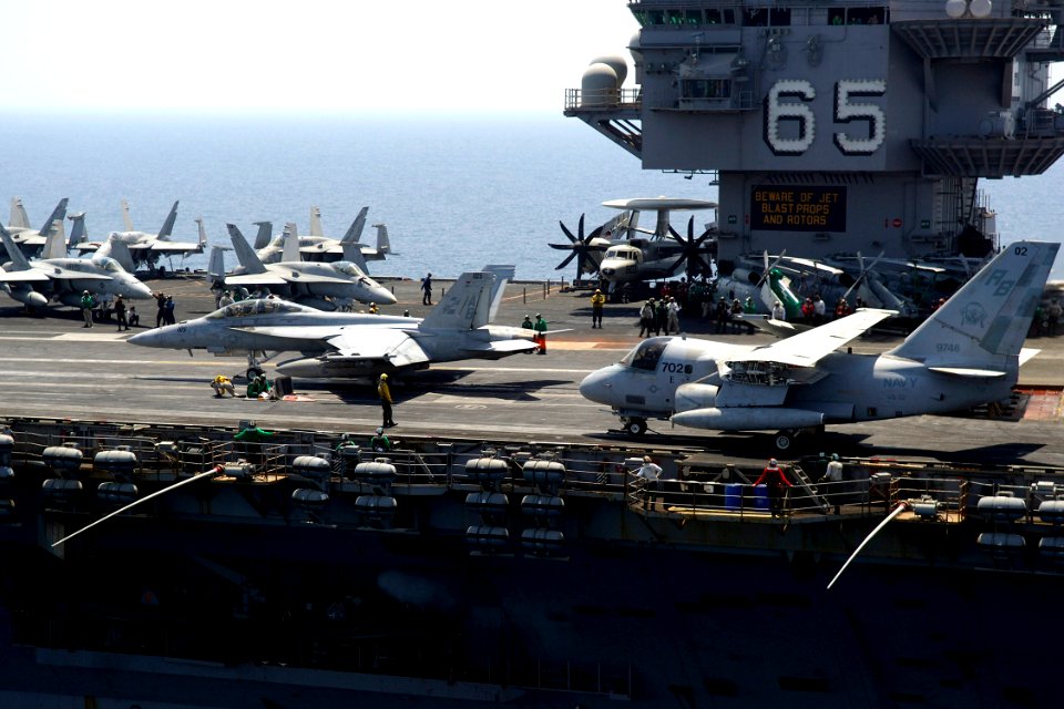 US Navy 070817-N-6524M-006 An F-A-18F Super Hornet attached to the Checkmates of Strike Fighter Squadron (VFA) 211 and an S-3B Viking, attached to the Maulers of Sea Control Squadron Three Two (VS-32) prepare for catapult assis