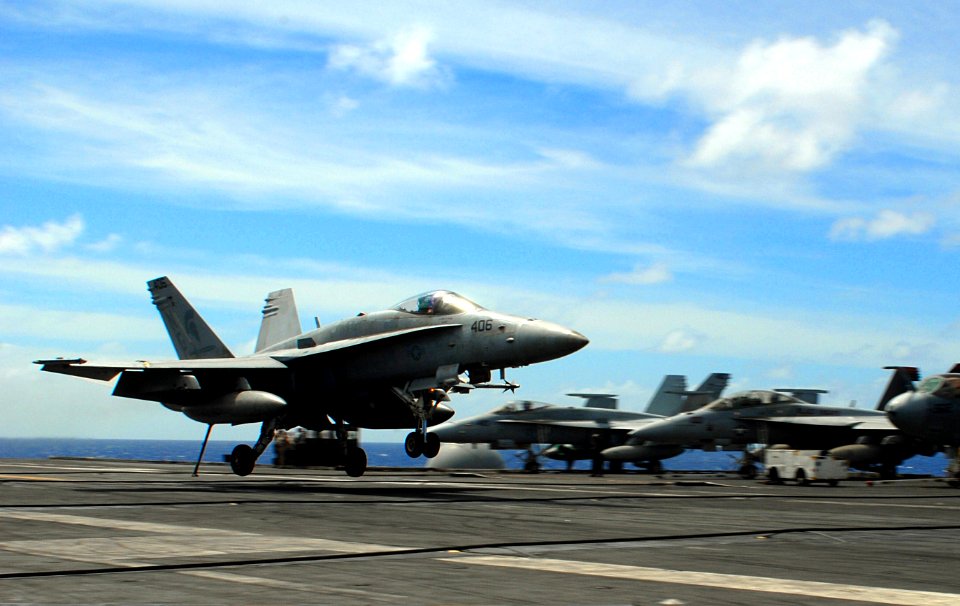 US Navy 070819-N-3541A-024 An F-A-18C Hornet, from the Argonauts of Strike Fighter Squadron (VFA) 147, lands on the flight deck of Nimitz-class aircraft carrier USS John C. Stennis (CVN 74)