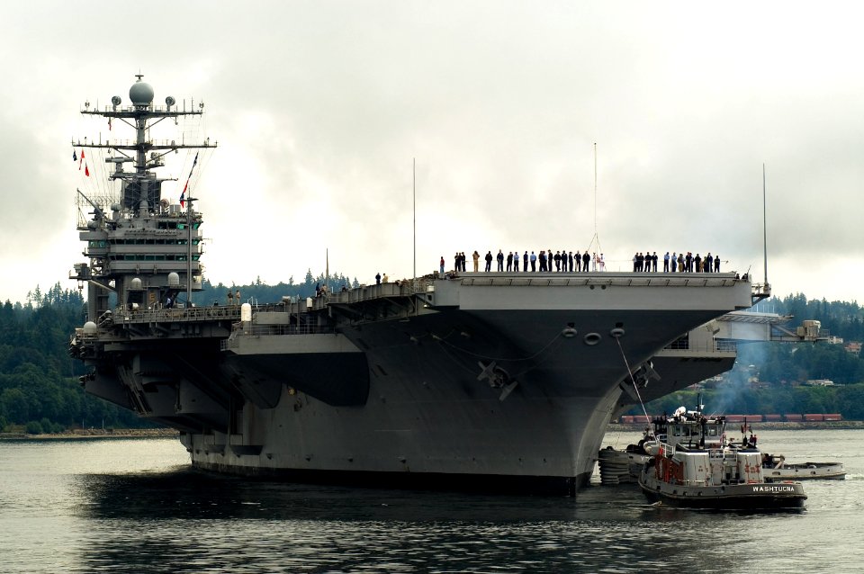 US Navy 070820-N-3390M-002 Nimitz-Class aircraft carrier USS Abraham Lincoln (CVN 72) prepares to moor pierside at her homeport of Naval Station Everett after a scheduled underway period photo