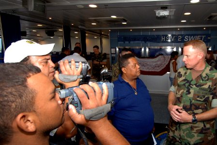 US Navy 070820-N-0989H-053 Capt. Douglas Wied, commander of Task Group 40.9, takes part in an interview with local media during a reception aboard High Speed Vessel (HSV) 2 Swift photo