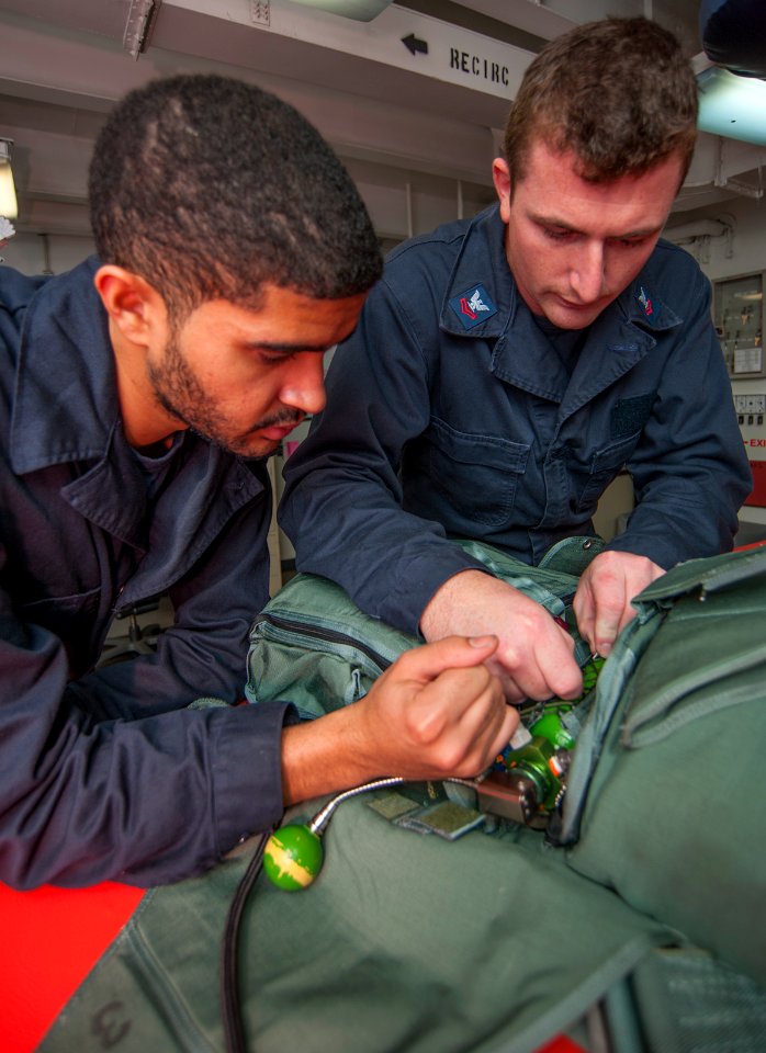 USS Carl Vinson Sailors conduct parachute maintenance 141111-N-TP834-024