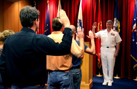 US Navy 070820-N-3271W-003 Rear Adm. Gerald R. Beaman, commander of Strike Force Training Pacific, conducts an oath of enlistment for six new recruits at the Military Entrance Processing Station photo