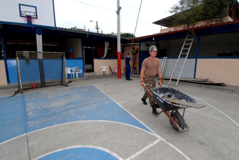 US Navy 070819-N-8704K-091 Builder 1st Class Austin Prewitt, a Seabee with Constuction Battalion Maintenance Unit (CBMU) 202, transports tools for repairs at the Luis Teodoro Cantos School