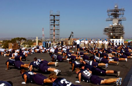 US Navy 070821-N-0555B-131 Members of the University of San Diego Toreros football team perform push-ups on the flight deck of USS Ronald Reagan (CVN 76) photo