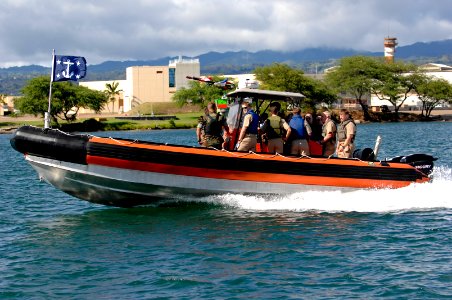 US Navy 070823-N-3642E-608 Secretary of the Navy (SECNAV) the Honorable Dr. Donald C. Winter is transferred to the Naval Special Warfare Compound on a rigid-hulled inflatable boat