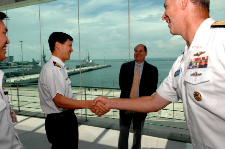 US Navy 070821-N-3642E-130 Singapore's Chief of the Navy Rear Adm. Ronnie Tay, Secretary of the Navy (SECNAV) the Honorable Dr. Donald C. Winter, and Rear Adm. William Burke share a laugh as introductions are made prior to a to