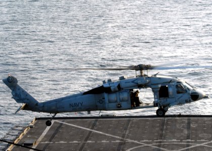 US Navy 070823-N-6710M-005 An MH-60S Seahawk prepares to land on the flight deck aboard USS Tortuga (LSD 46) while conducting flight operations in preparations for the ship's fall patrol photo