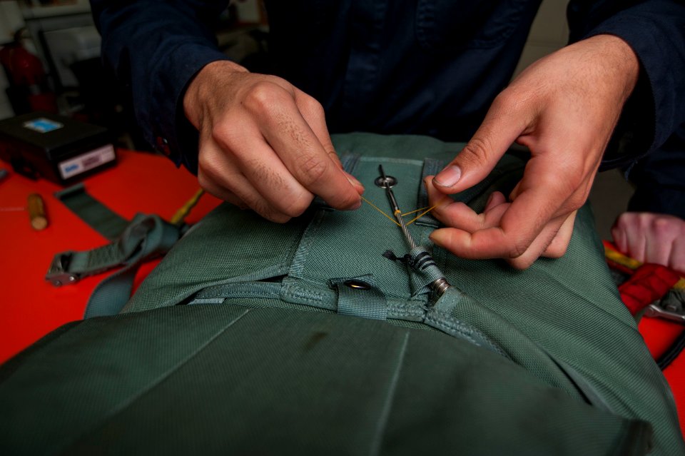 USS Carl Vinson Sailors conduct parachute maintenance 141111-N-TP834-062