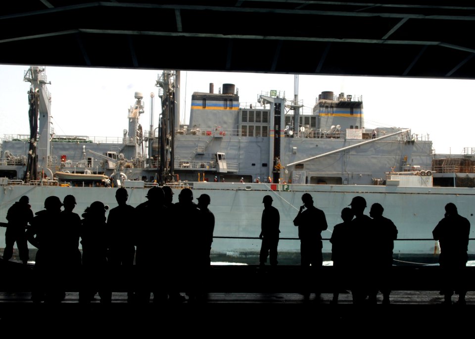 US Navy 070820-N-5928K-043 Sailors assigned to USS Enterprise (CVN 65) deck department standby as the fast combat support ship USNS Supply (T-AOE6) prepares to detach after completing a replenishment-at-sea