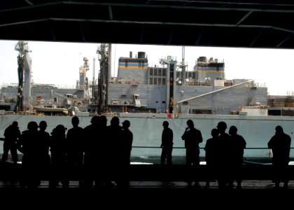 US Navy 070820-N-5928K-043 Sailors assigned to USS Enterprise (CVN 65) deck department standby as the fast combat support ship USNS Supply (T-AOE6) prepares to detach after completing a replenishment-at-sea