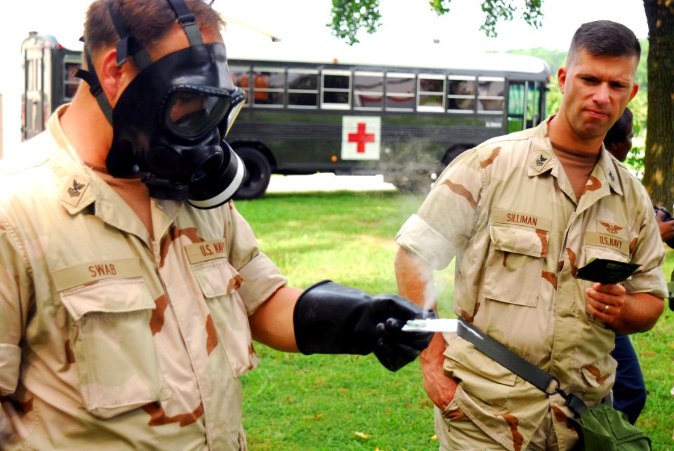 US Navy 070821-N-8907D-081 Gunner's Mate 1st Class David Swab takes a reading during chemical, biological and radiological defense training with Naval Customs Battalion (NCB) Tango on board Cheatham Annex